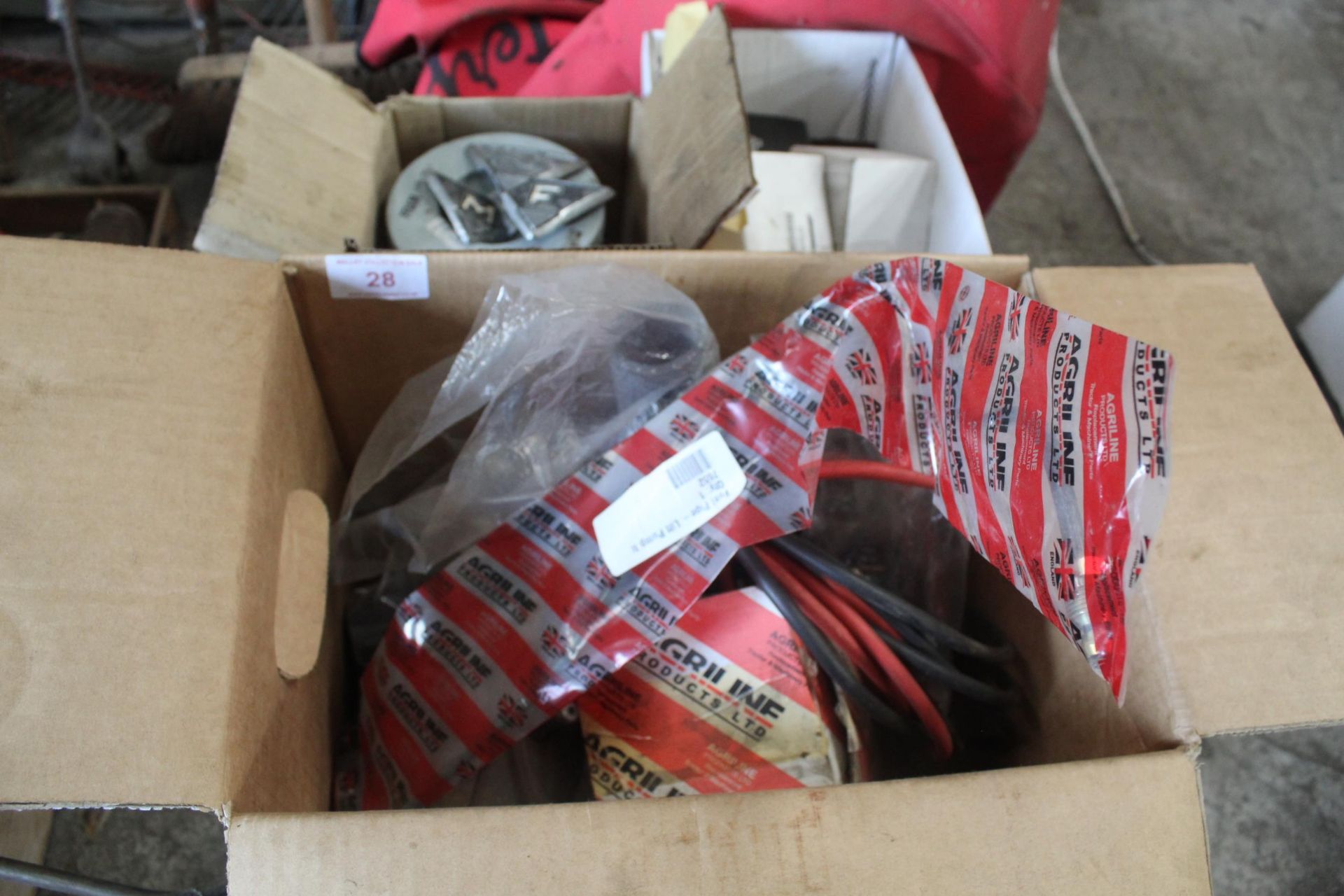 THREE BOXES OF ASSORTED TRACTOR SPARES TO INCLUDE MASSEY FERGUSON, INCLUDING HEAD LAMP, FILTERS