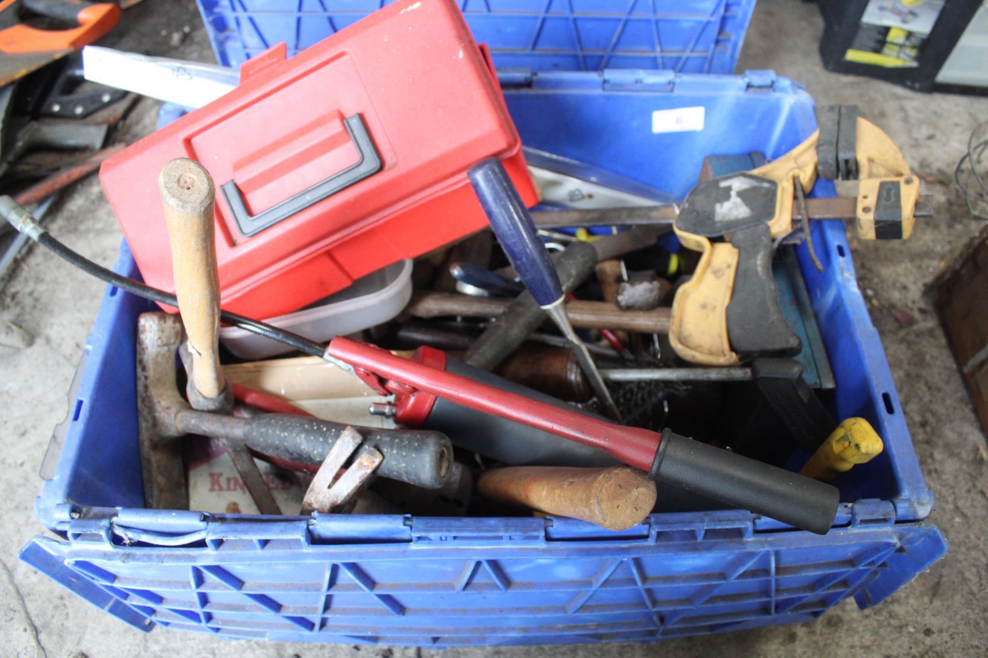 AN ASSORTMENT OF HAND TOOLS TO INCLUDE A GREASE GUN, HAMMERS AND CLAMPS ETC