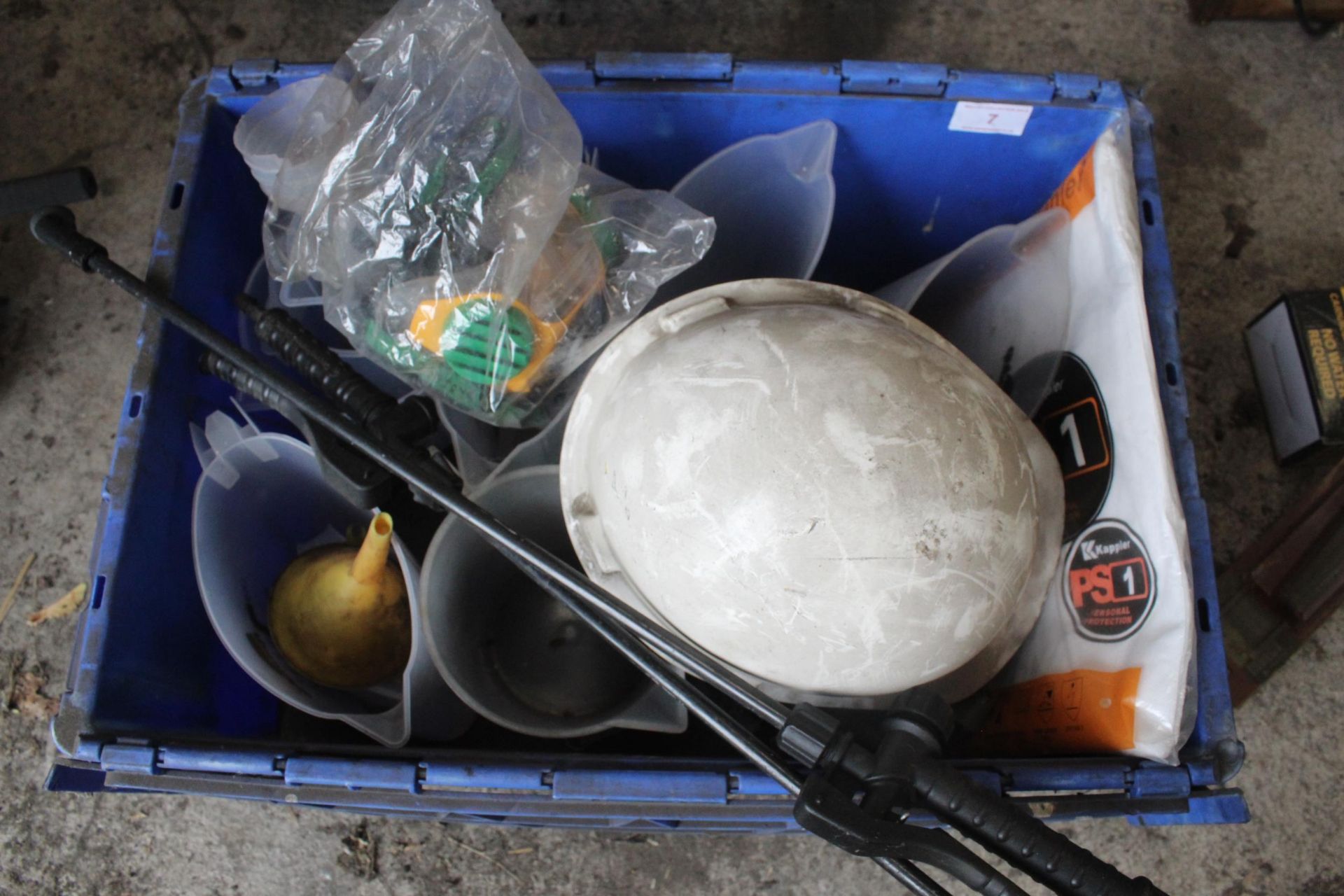 AN ASSORTMENT OF ITEMS TO INCLUDE MEASURING JUGS AND A HARD HAT ETC