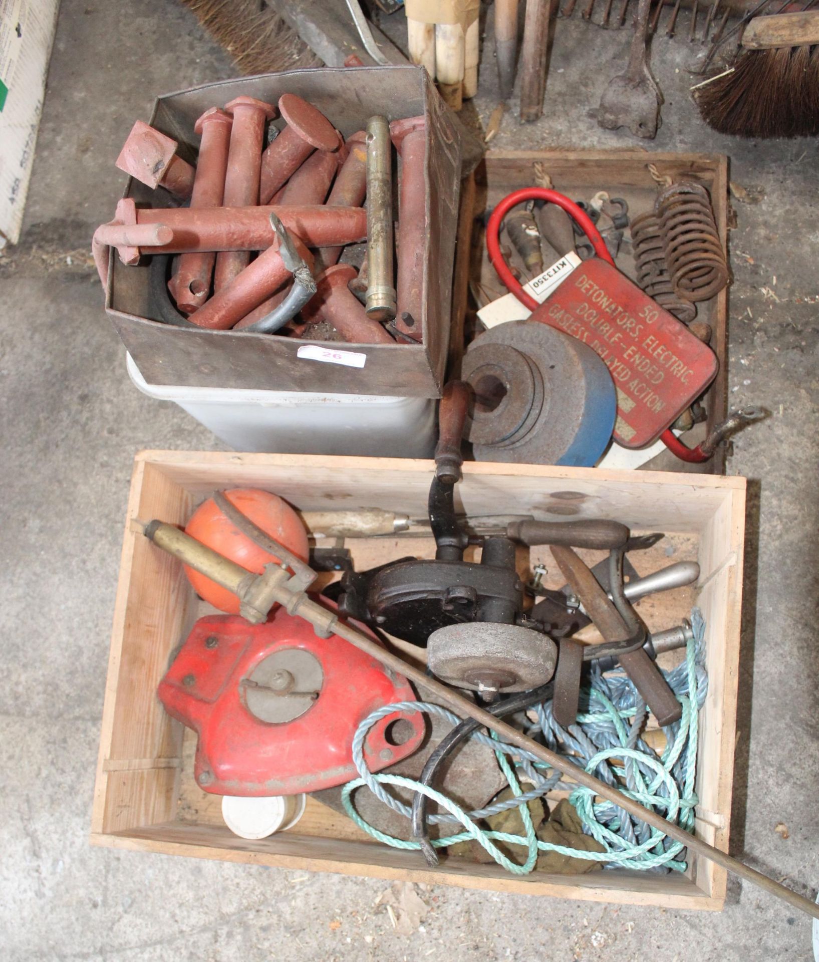 AN ASSORTMENT OF ITEMS TO INCLUDE A SHARPENING STONE, TRACTOR PINS AND SPRINGS ETC