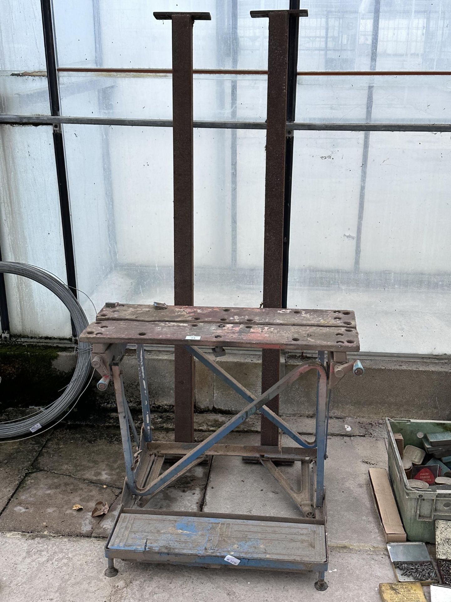 A FOLDING WORKMATE BENCH AND A PAIR OF STEEL ARMS NO VAT