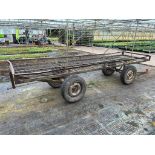 A FOUR WHEEL MARKET GARDEN TRAILER APPROX 12' LONG RED HITCH+ VAT TO BE COLLECTED FROM NEWBURGH NEAR