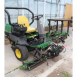 A JOHN DEERE 2500 RIDE ON MOWER COMES WITH SPARE SET OF CUTTING REELS AND A SET OF DE-THATCHER ROLLS