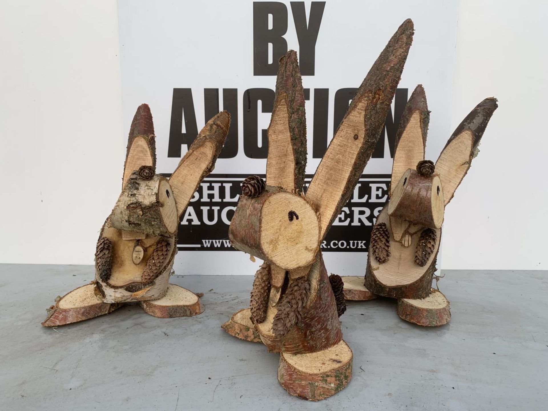 THREE RABBIT FIGURES MADE FROM LOGS + VAT TO BE SOLD FOR THE THREE