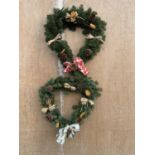 TWO HEART SHAPED WREATHS WITH ORANGE, RAFIA, CONE AND RIBBON + VAT TO BE SOLD FOR TWO