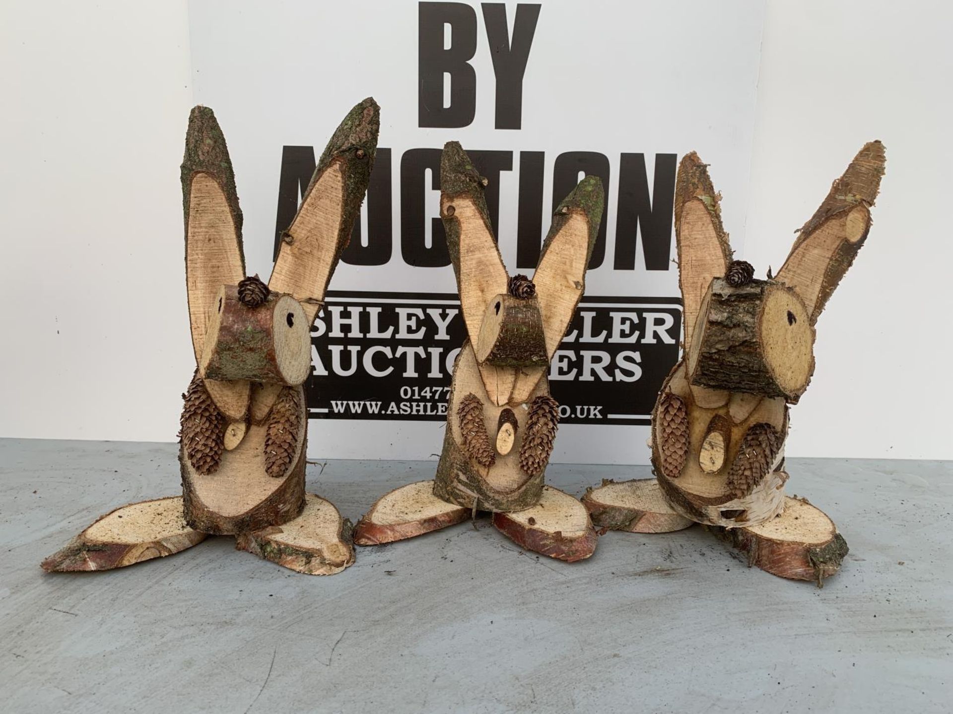 THREE RABBIT FIGURES MADE FROM LOGS + VAT TO BE SOLD FOR THE THREE