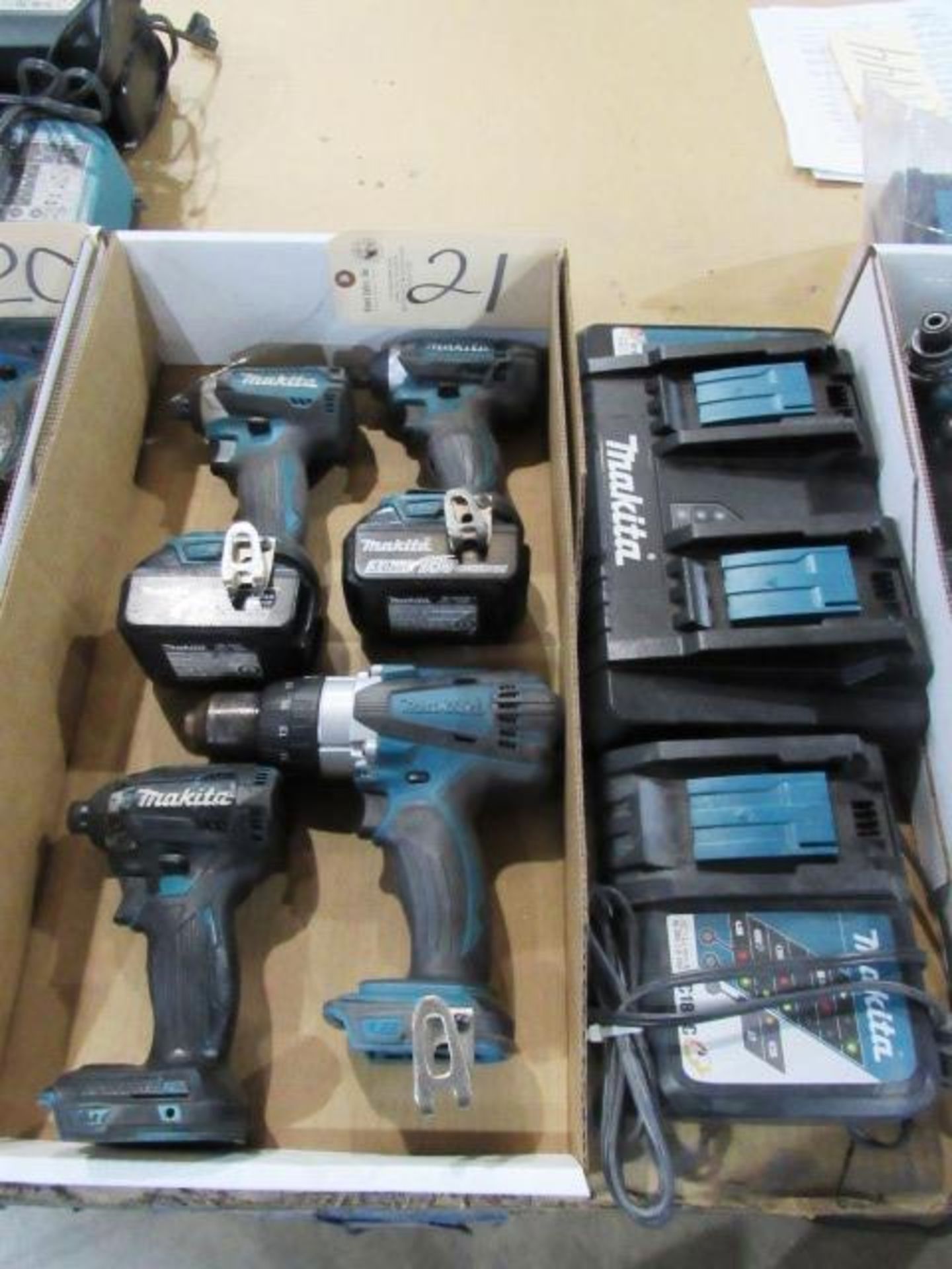 (1) Makita Drill, (3) Drivers, (2) Batteries, (2) Chargers