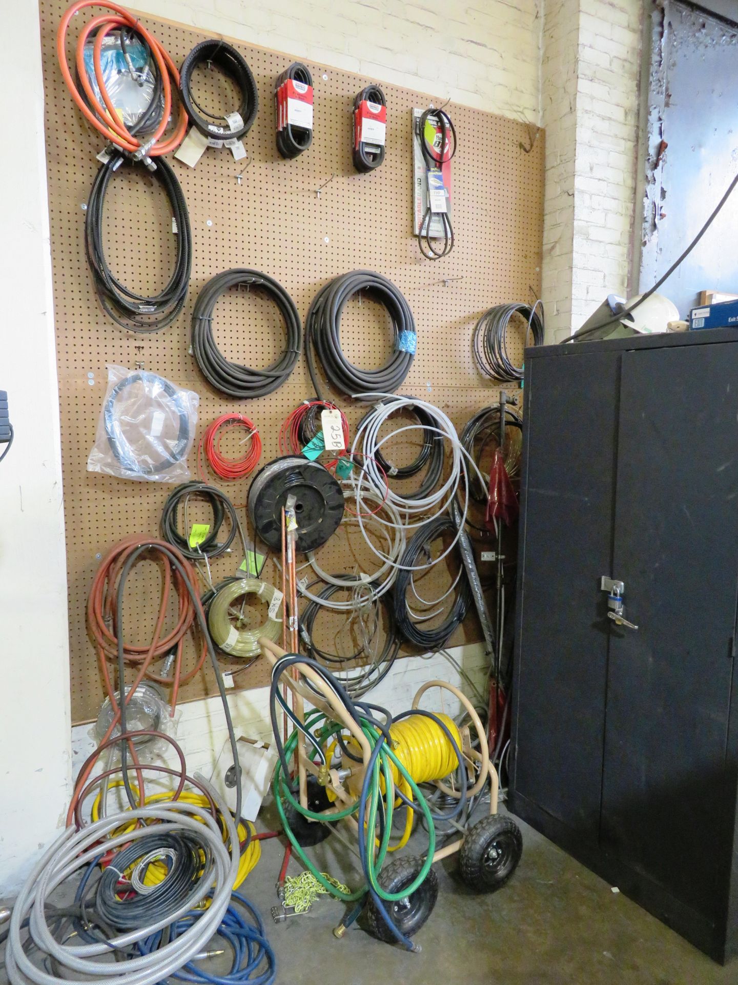 Large Assortment of Hosing & Belts (Some New) On Wall