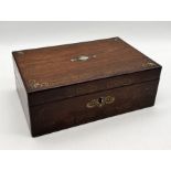 A Victorian rosewood writing box with inlaid mother of pearl and scroll design