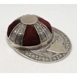 A Sterling silver pincushion in the form of a jockey cap