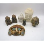 A mixed lot including three stone buddha heads, Aztec style wall mount etc.