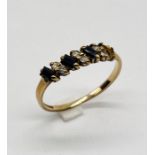 A 9ct gold sapphire and diamond ring - 1 stone missing