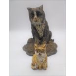 Two vintage cast iron door stops, both in the form of cats