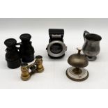 A collection of items including vintage leather cased binoculars, vintage bicycle lamp, brass bell