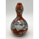 A 19th century Japanese double gourd vase with character marks to base - height 21cm