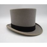 A grey top hat by Lincoln Bennett & Co of London in a Moss Bros hat box.