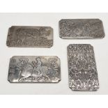 Four Chinese silver coloured ingots depicting dragons, monkeys etc - total weight 549.5g