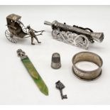 A small collection of silver and SCM items including a model cannon, Chinese silver rickshaw ,EPNS