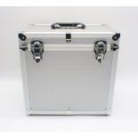 A metal 12" vinyl record lockable storage box with keys.