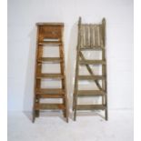 Two wooden step ladders.