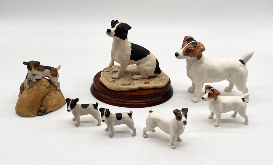 A collection of Jack Russell figures including Beswick, Country Artists and Aynsley