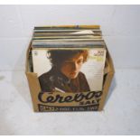 A quantity of 12" vinyl records including Bob Dylan, The Beatles, The Cars, John Lennon, Dire