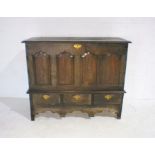 A large antique oak converted mule chest with drop down front revealing shelves with three drawers