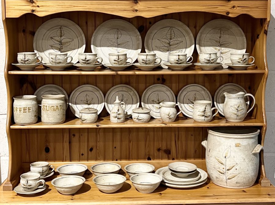 A large studio pottery part dinner service made as a commission piece by Mike Fletcher, including