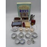 An Usborne slot-together Victorian dolls house, along with a small selection of dolls house