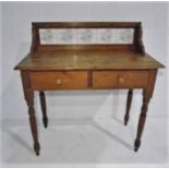 A vintage tiled washstand with two drawers.