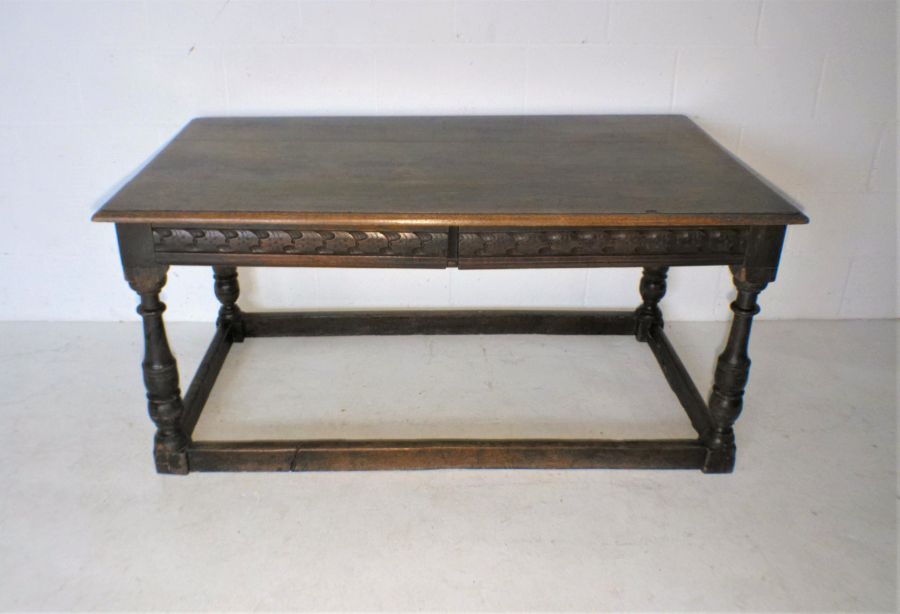 A part 17th century oak table with two frieze drawers and carved detailing, length 150cm, width