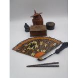 A collection of Oriental items including tobacco jar in the form of a Buddha, hand painted fan,