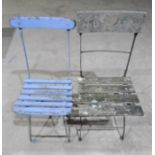 Two vintage metal framed, weathered folding garden chairs.