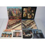 A small collection of The Beatles and related 12" and 7" vinyl records including 'Sgt. Pepper's
