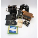 A Kodak Brownie Flash III vintage camera along with an Ensign Carbine No. 5 camera, three pairs of