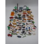 A collection of mainly plastic toy animals and accessories etc