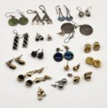 A collection of silver and other earrings