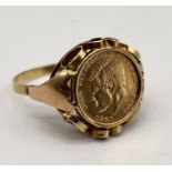 A 14ct gold scrolled ring set with a John. F. Kennedy commemorative coin also marked 585 - total