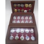 A collection of modern pocket watches in display cabinets