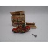 A boxed Schuco Curvo 1000 tinplate clockwork motorcycle with key and instructions - box A/F