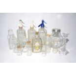 A collection of glassware including soda siphons, scent bottles etc.