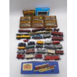 A collection of various model railway OO gauge wagons (some boxed) including tankers, timber wagons,