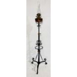 A wrought iron and copper oil-burner standard lamp with Joseph Hinks duplex no.2 burner and marked