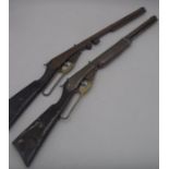 Two matching vintage children's toy rifles - one missing part of the barrel
