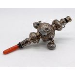 A continental silver (800) baby's silver and coral teether, whistle and rattle, length 9.5cm