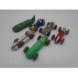 A collection of five unboxed vintage Dinky Toys die-cast racing cars including Masserati (No 231),