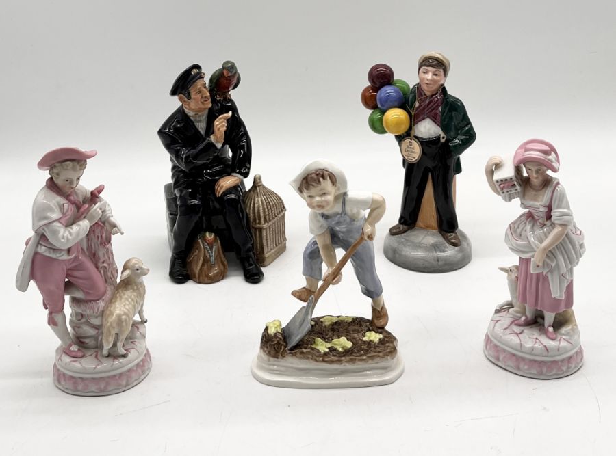 A collection of figurines including Royal Doulton Balloon Boy, Royal Worcester Saturday's Child,