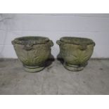 A pair of reconstituted stone garden urns