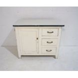 A vintage white painted cupboard with three drawers and enamel top, length 92cm, depth 46cm,