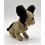 A German early 20th century mohair and velvet seated Bully dog with glass eyes and stitched nose -
